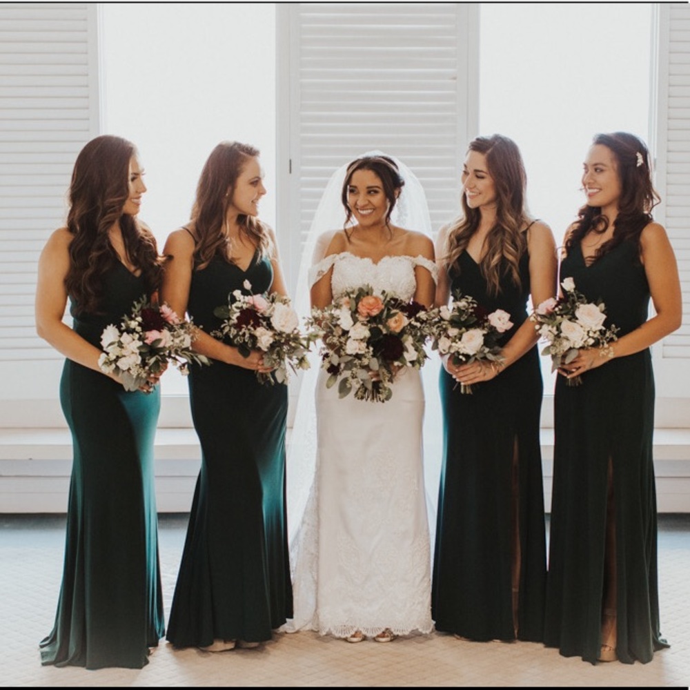Dark green formal dress with a high leg slit